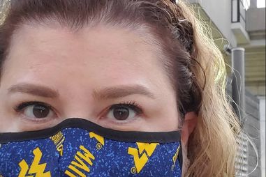 Jenny wearing a WVU mask during COVID-19