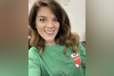 Carly with a selfie, wearing a green shirt.